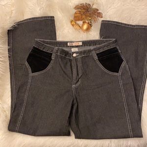 Black denim jeansWith black velvet embellishments. Size 14